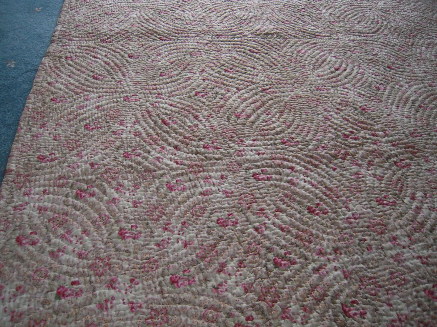 Detail of pink and cream quilt