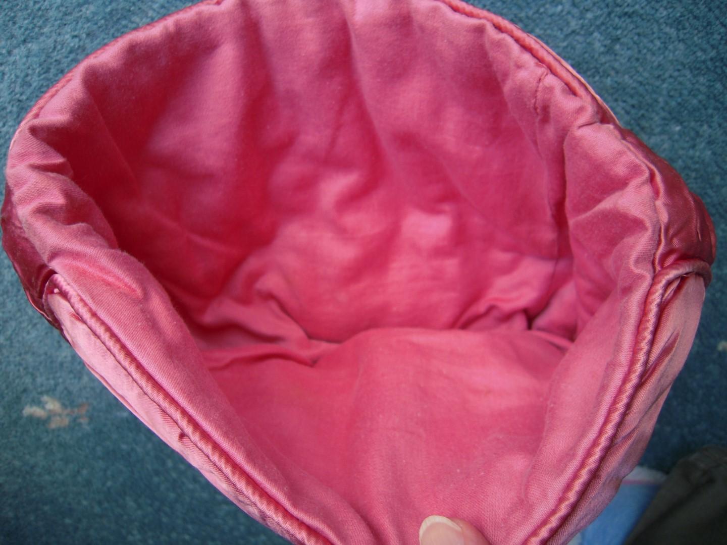 Showing inside of pink tea cosy
