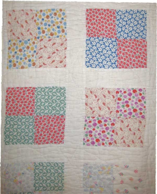 Pastel floral four patch on white quilt