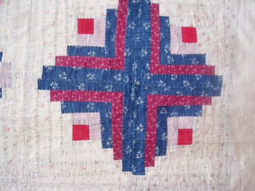 Blue and red cross on white fabric