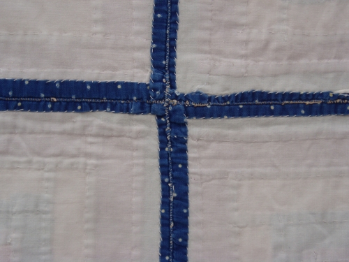 white fabric with thin blue cross