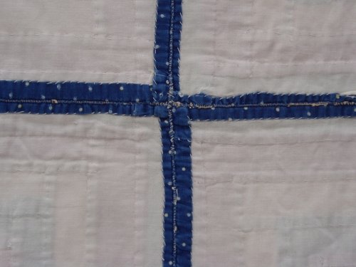 white fabric with thin blue cross