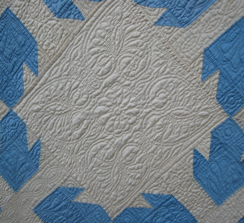 quilted hearts on white with pale blue.