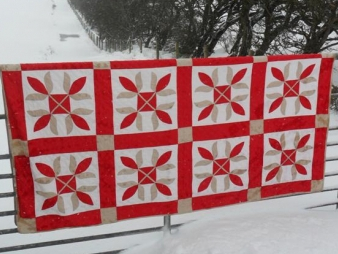 Red white and beige applique quilt