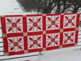 Red white and beige applique quilt
