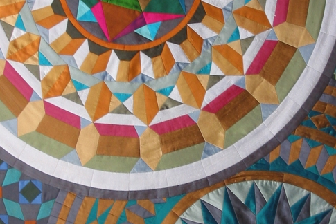 Quilt detail of Multi coloured large mosaic circle