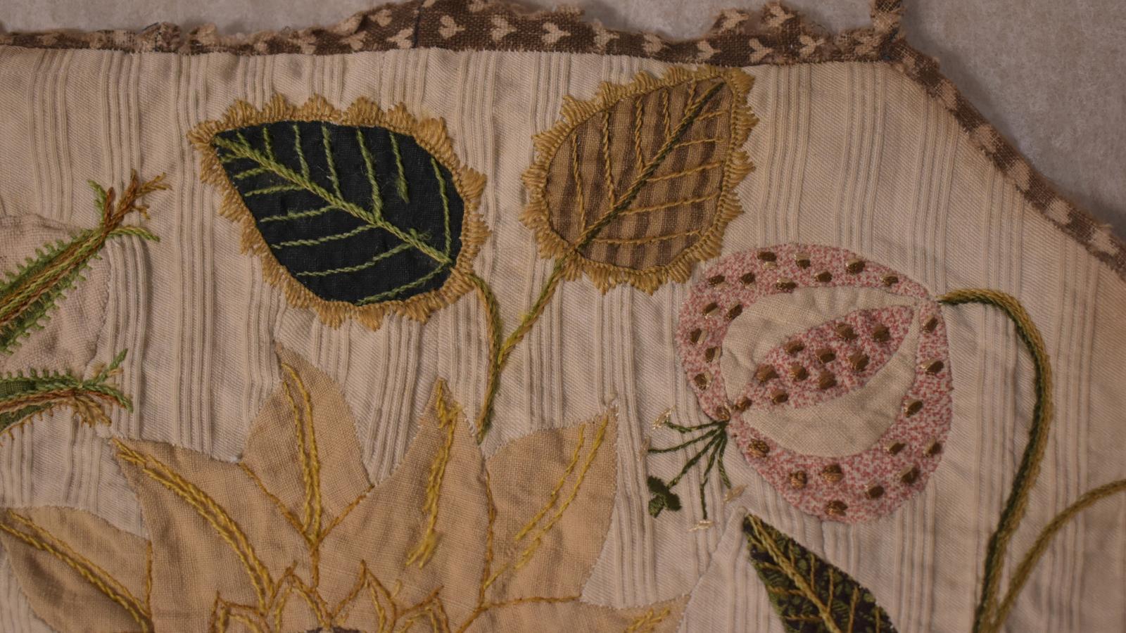 Two leaves and flower with embroidered features