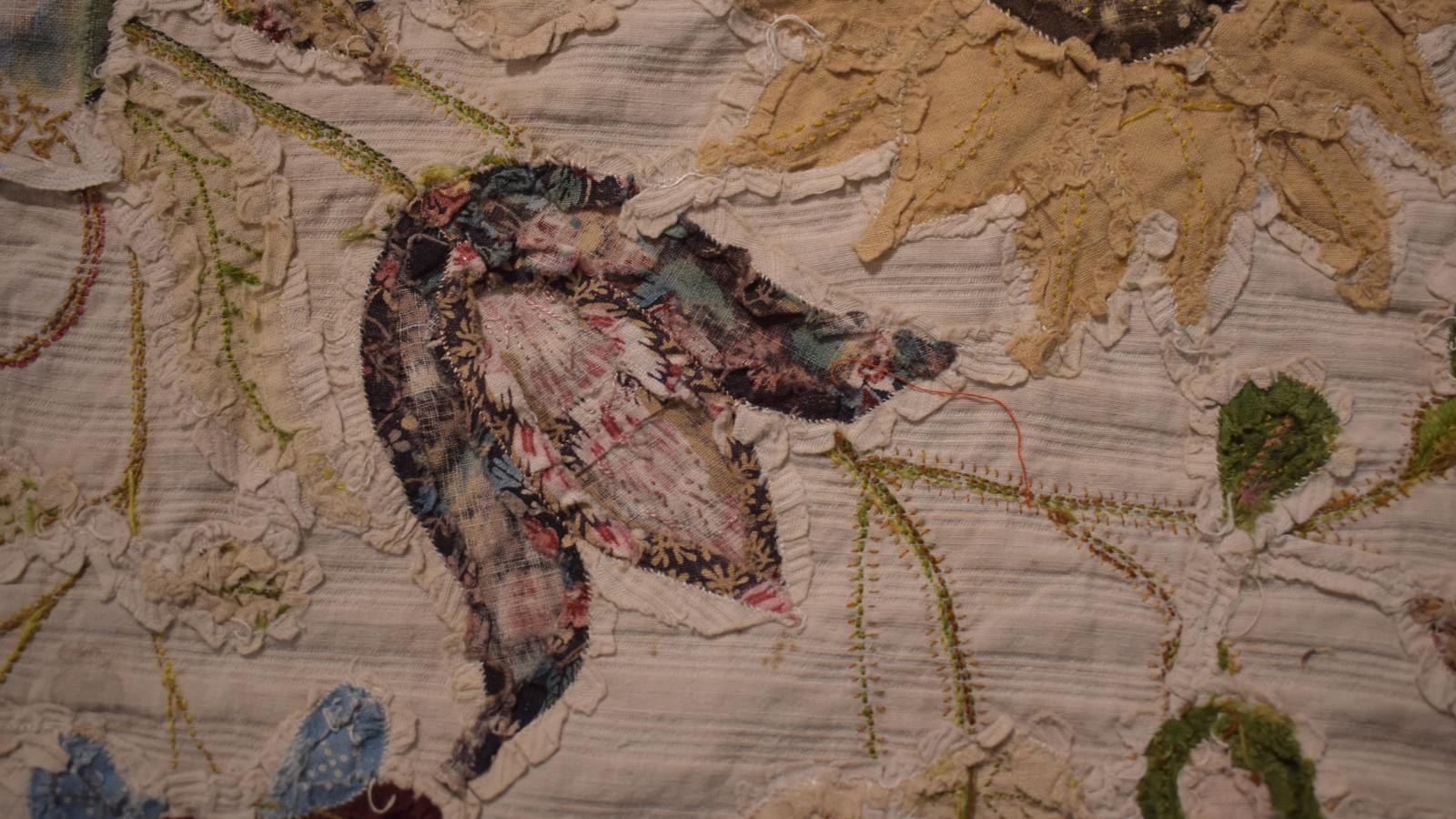 Fabric tulip inlaid into background, showing seam allowances