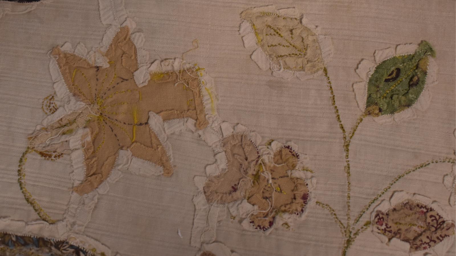 Fabric daffodil inlaid into background, showing seam allowances