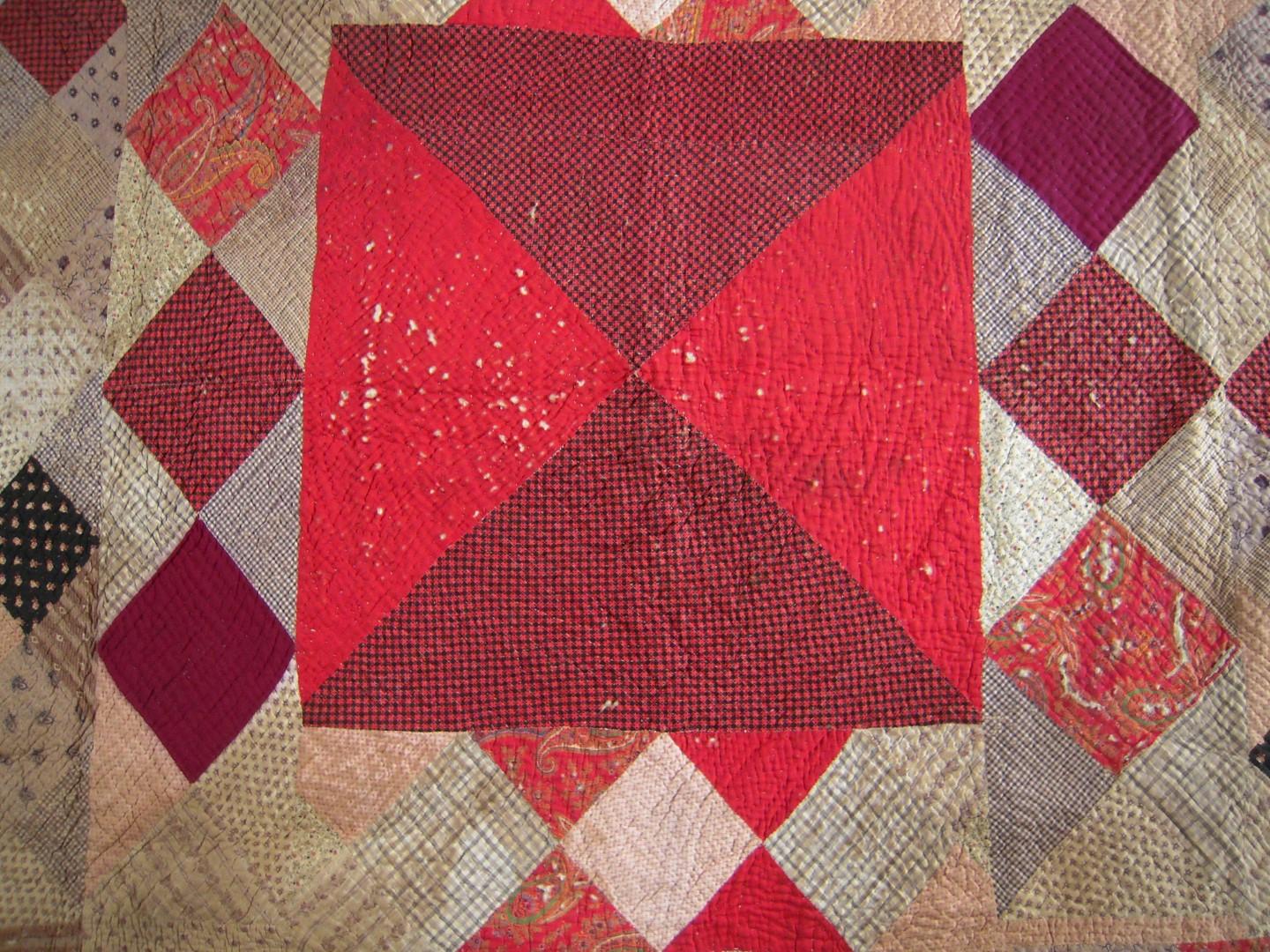 Large bowtie block in red and a red and black fabric