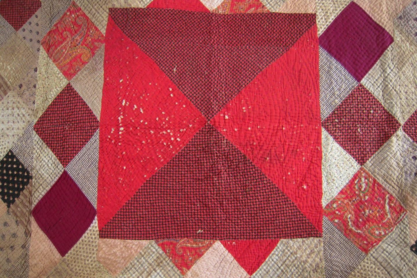 Red patchwork with red and pale squares on point