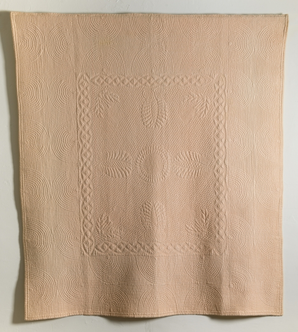 Beige quilt with stitching