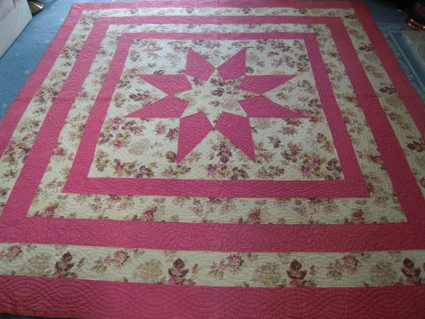 Pink and Floral quilt in a star pattern