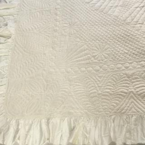 Corner of cream quilt