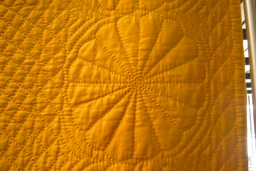 gold quilt detailed stitching