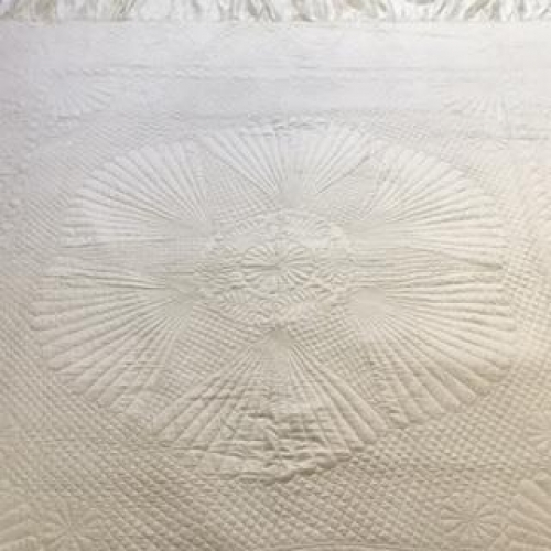 Cream quilt detail of stitching