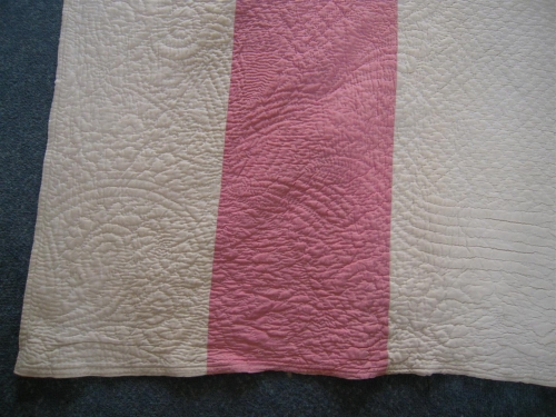 Detail of corner pink and white quilt