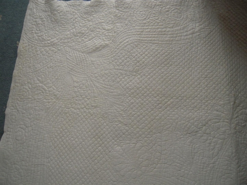 White side of quit with stitching detail