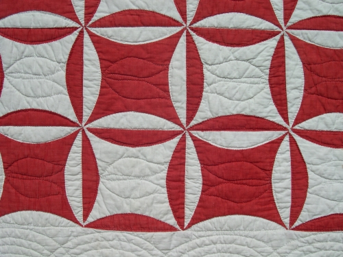 Red and white patchwork quilt