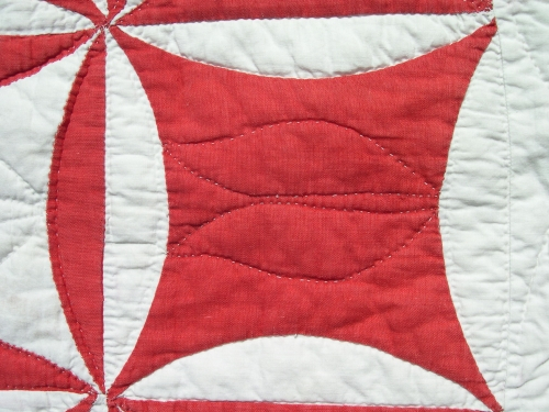 Red and white quilt detail of block