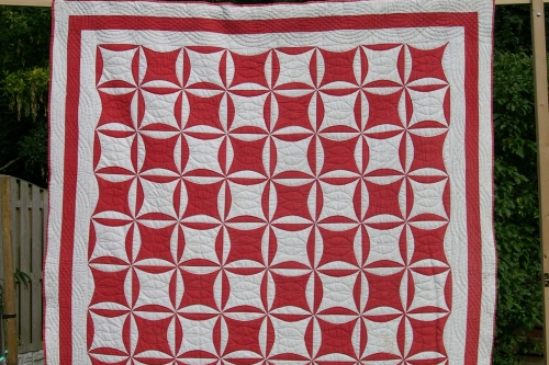 Red and white patchwork quilt