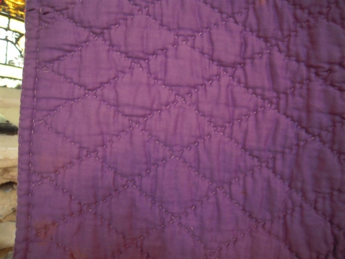 Mauve quilt with diamond quilting