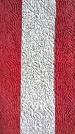 Red and white quilt detail