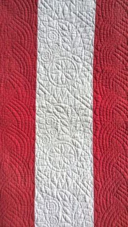 Red and white quilt detail