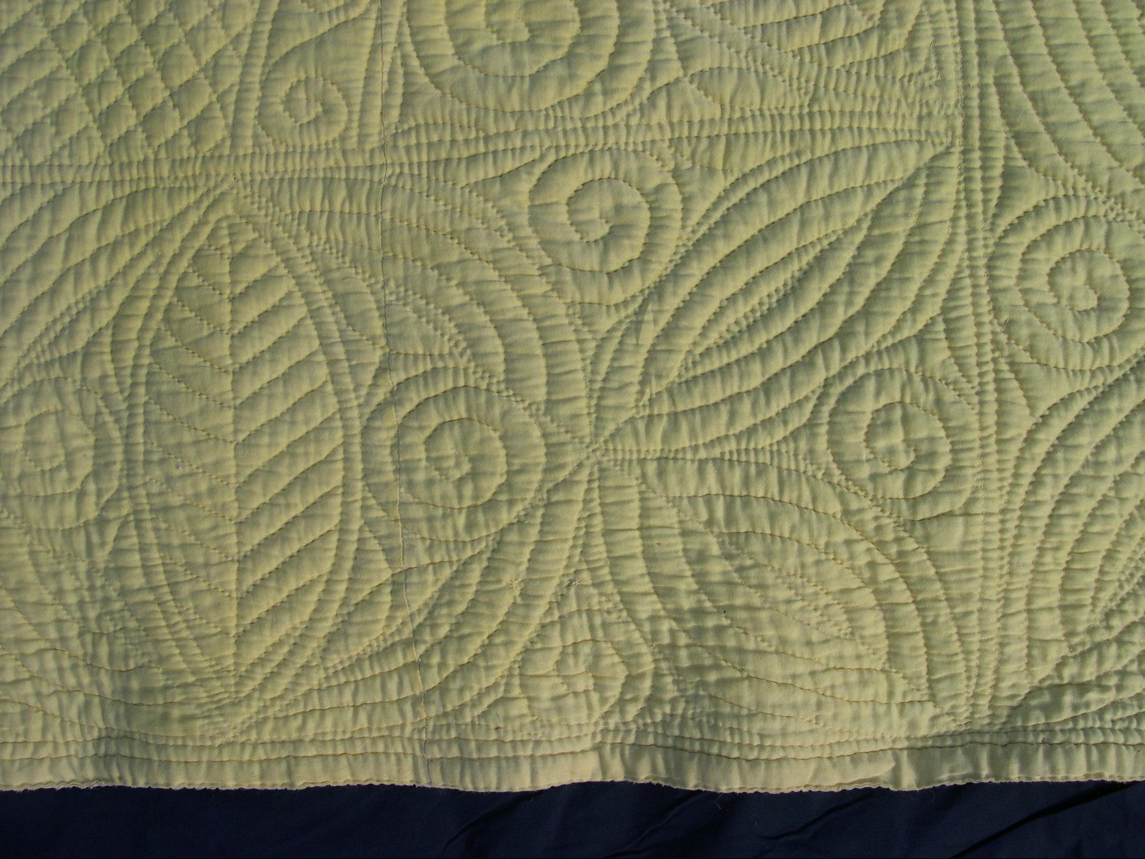 Border detail of pale yellow quilt