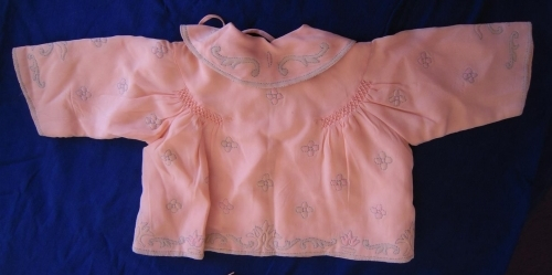 Back of pink baby's jacket