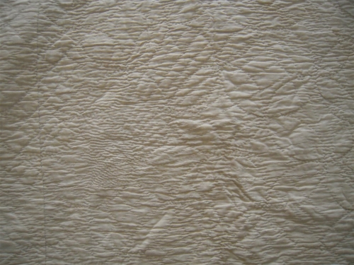 Cream quilt with detailed stitching