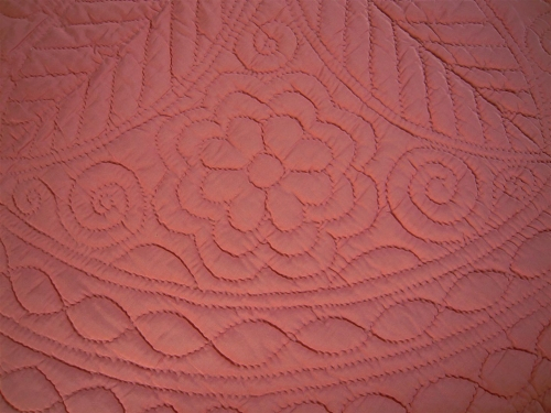 Peach quilt close up stitched detail