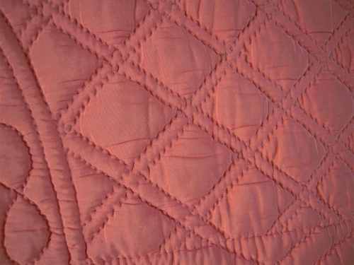 Peach quilt stitching detail