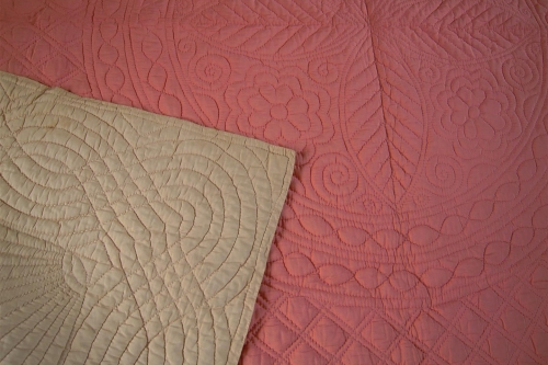Cream corner folded over peach quilt