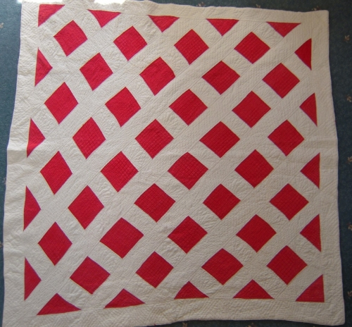 Red squares with white lattice quilt