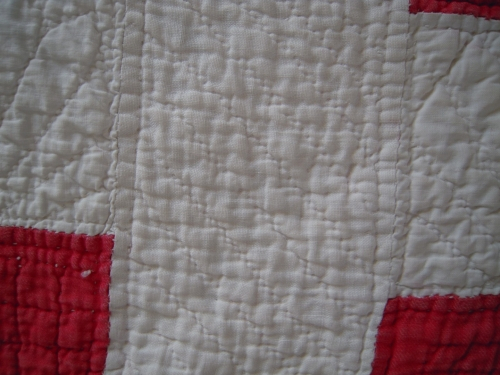 Red and white quilt detail