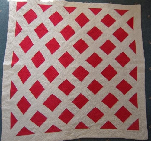 Red squares with white lattice quilt