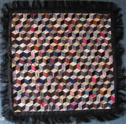 Multicoloured tumbling blocks patchwork with black fringe