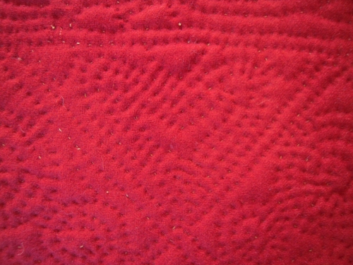 detail of red quilt
