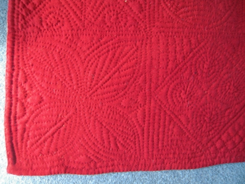 Corner of red quilt