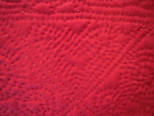 detail of red quilt