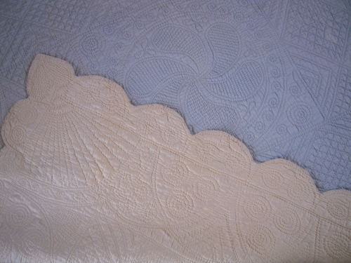 Blue quilt with cream corner turned over