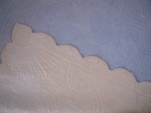 Blue quilt with cream corner turned over