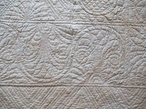 Detail of quilting on white reverse