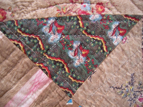 dark green fabric with red and yellow pattern