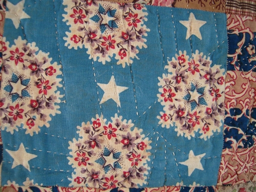 blue fabric with pink flowers on cream