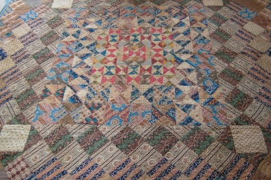 Patchwork quilt in blues and browns
