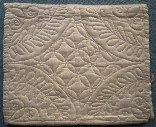 Stitching detail on back of cream case