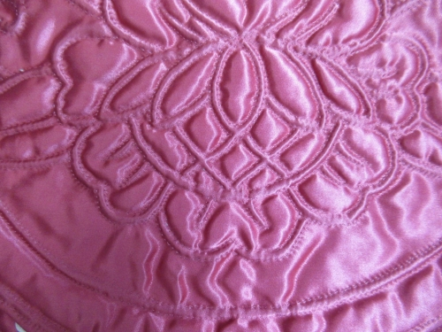 Pink satin case detail of quilting