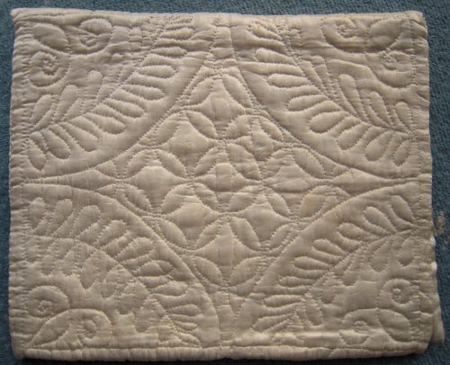 Stitching detail on back of cream case